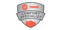 Trane Comfort Specialist badge: shield shape, silver and orange, reads 