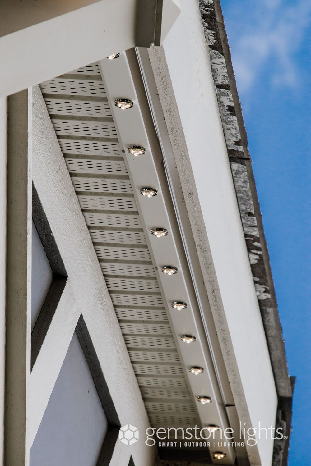 A picture of a building with the words gemstone lights on the bottom