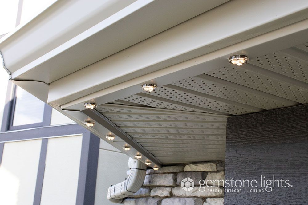 A picture of a roof with lights on it and the words gemstone lights on the bottom