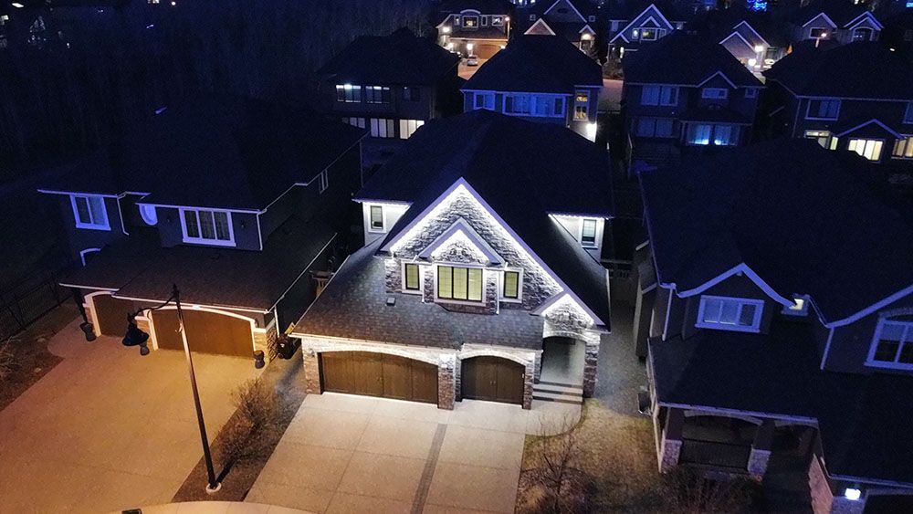 An aerial view of a residential neighborhood at night.
