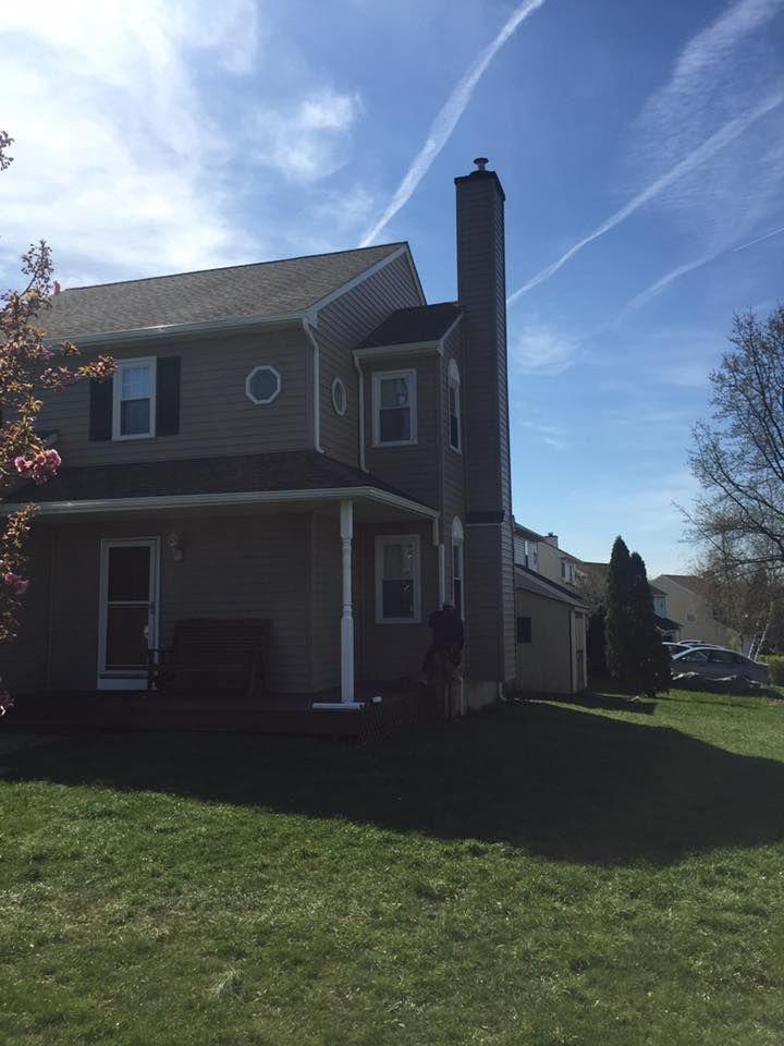 A house with a chimney on the side of it