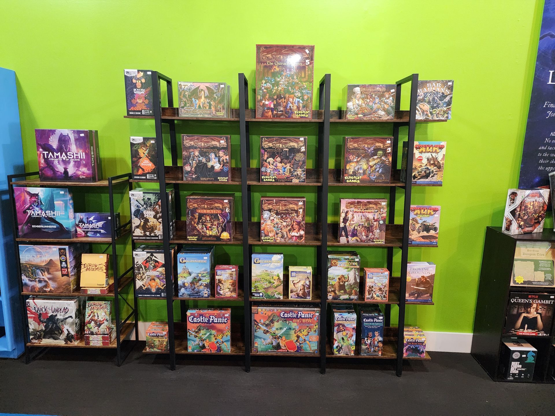 A display of board games on shelves inside the store