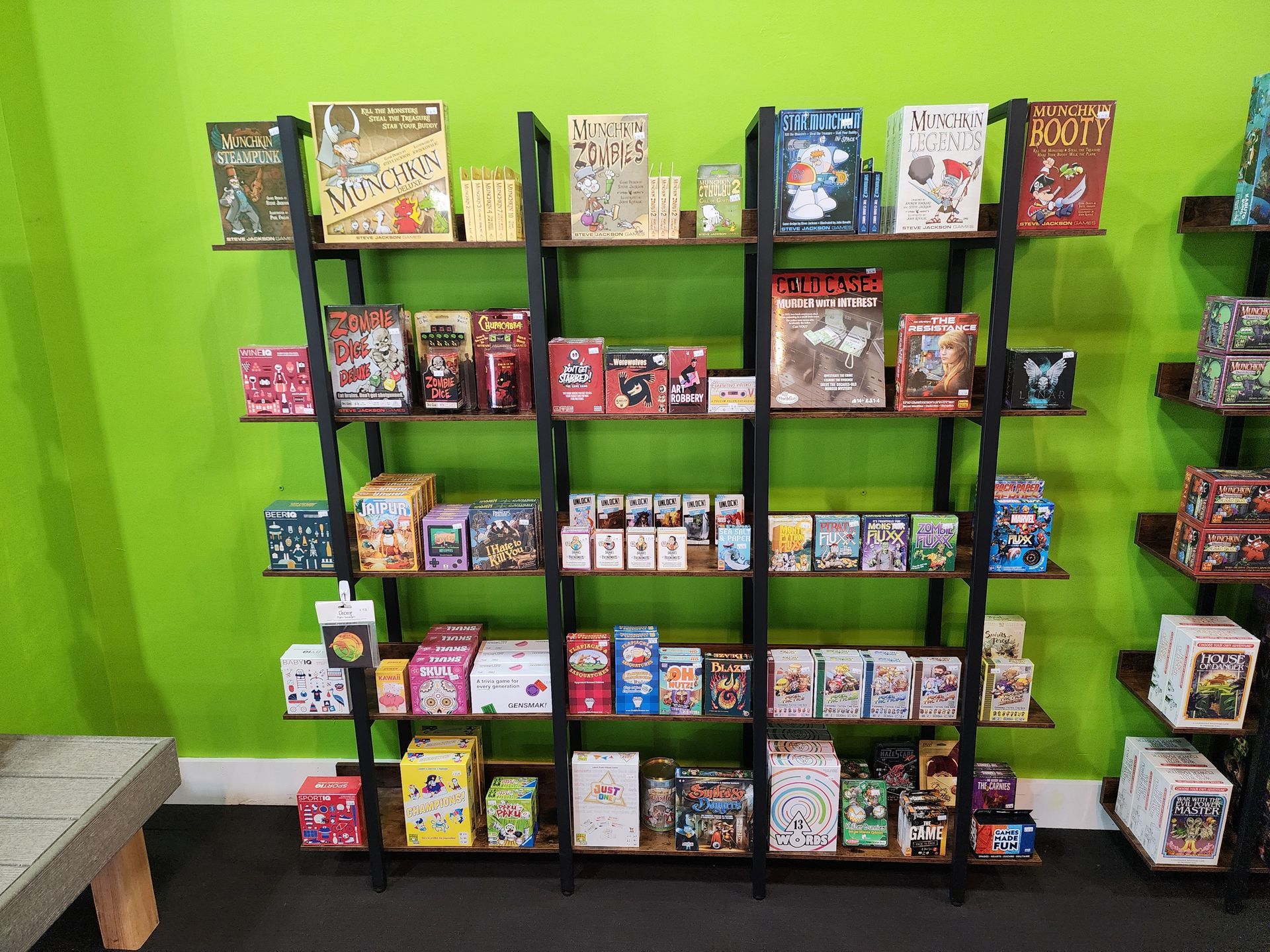 A shelf filled with lots of different types of games