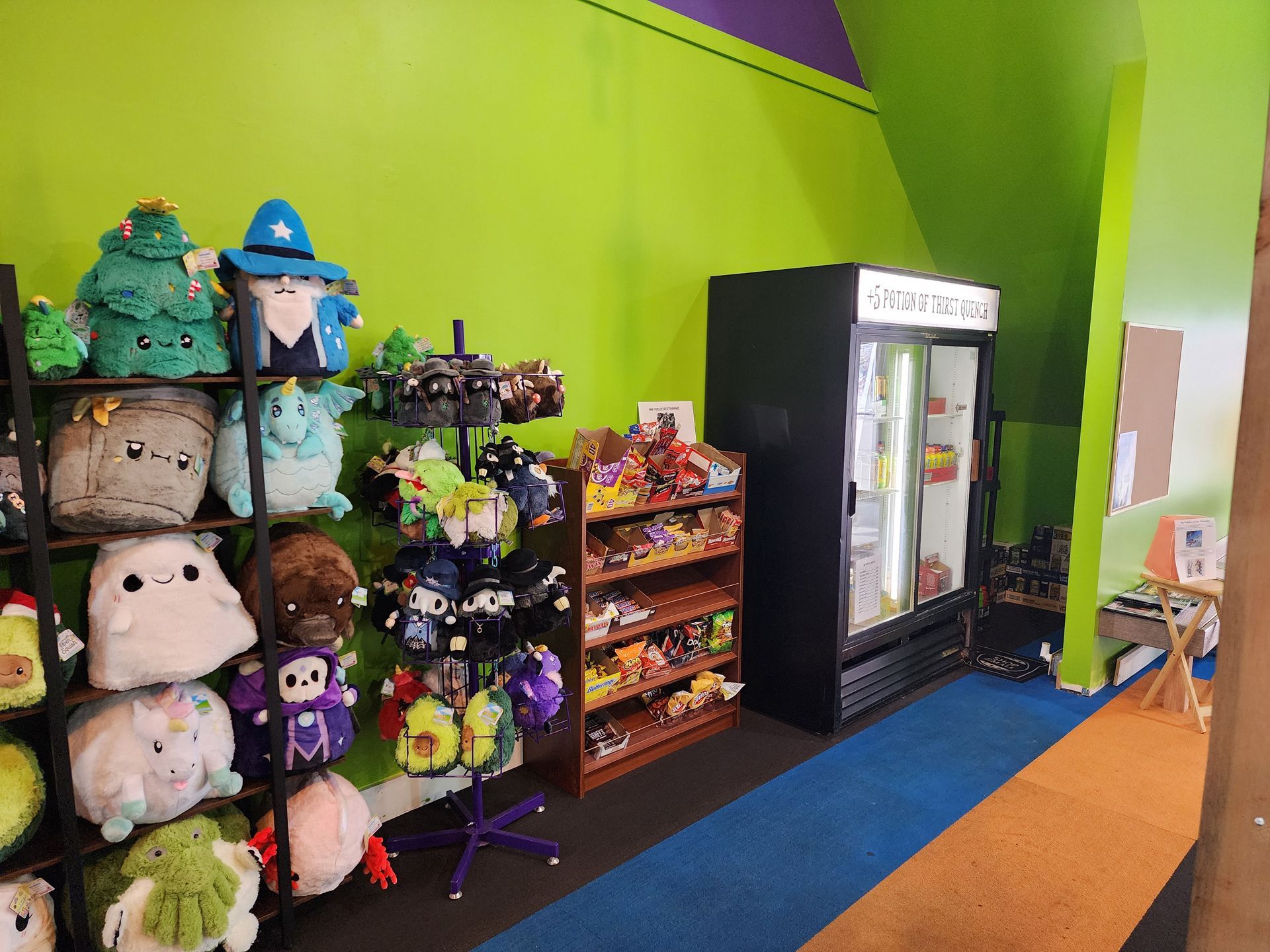 A room filled with stuffed animals and a refrigerator