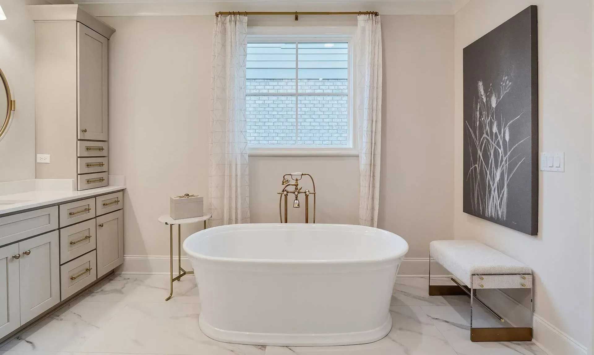 Luxurious bathroom with a freestanding tub and artwork.