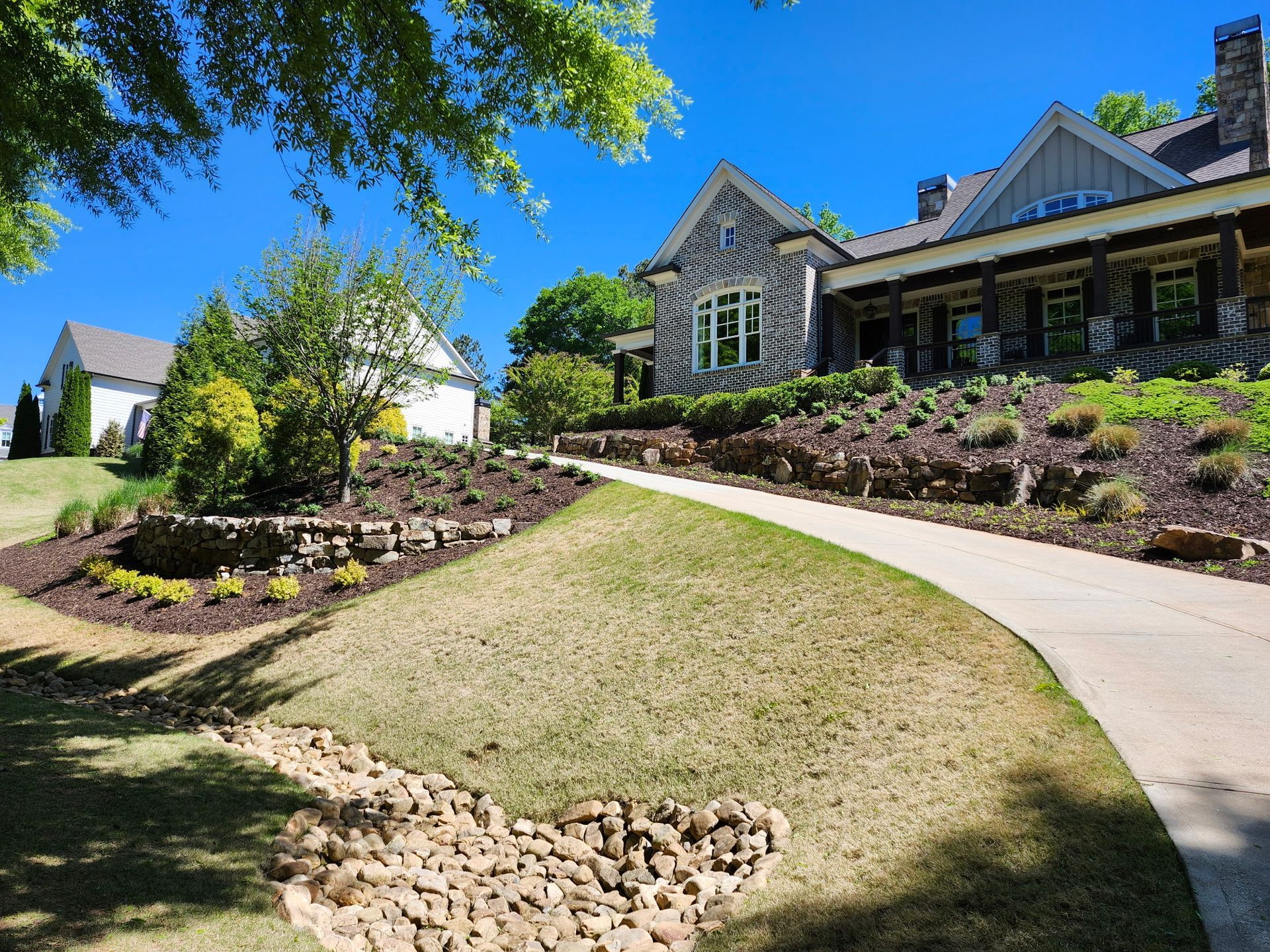 A large house with a driveway leading to it