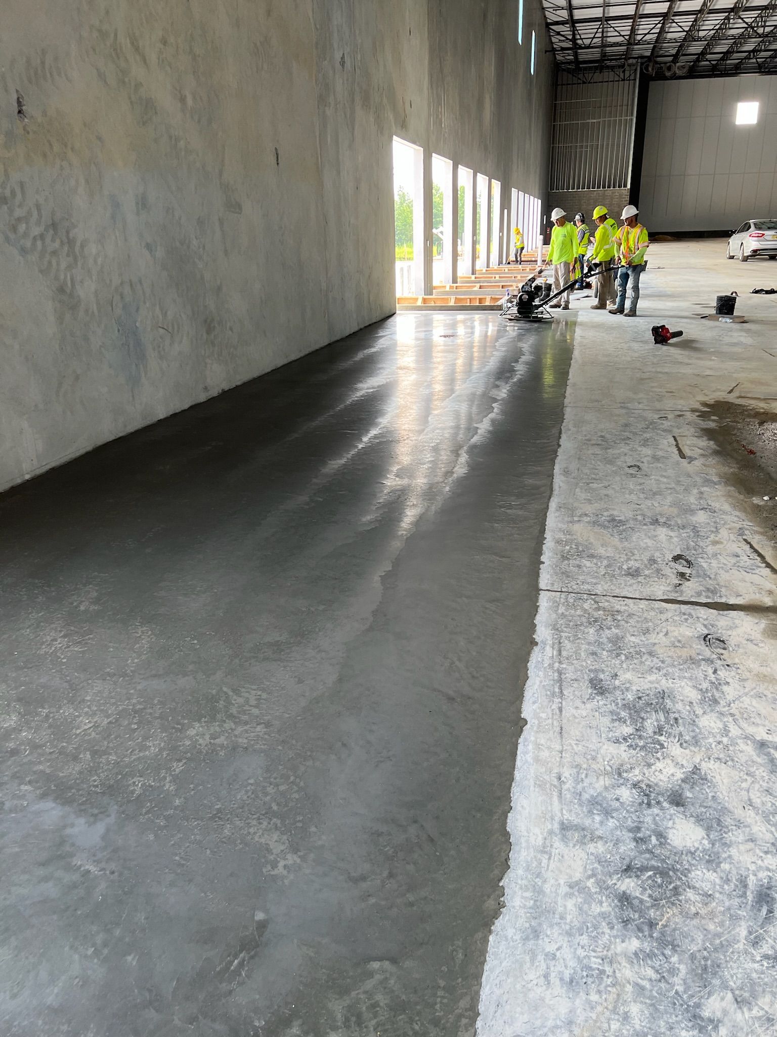 a group of construction workers is in a large room