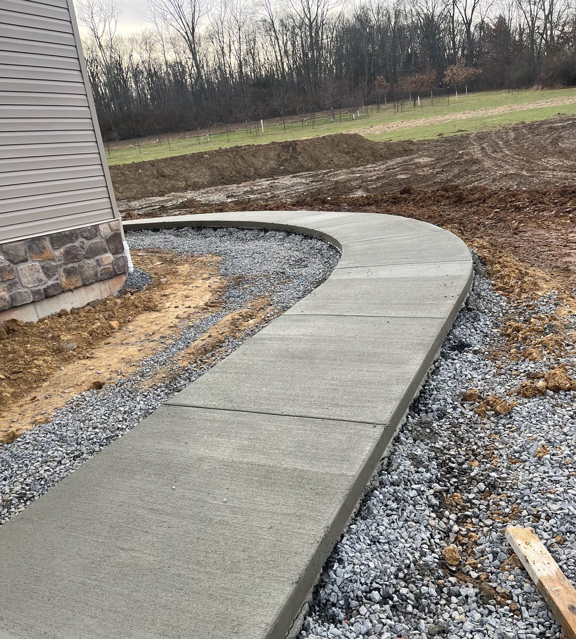 a concrete walkway is being built