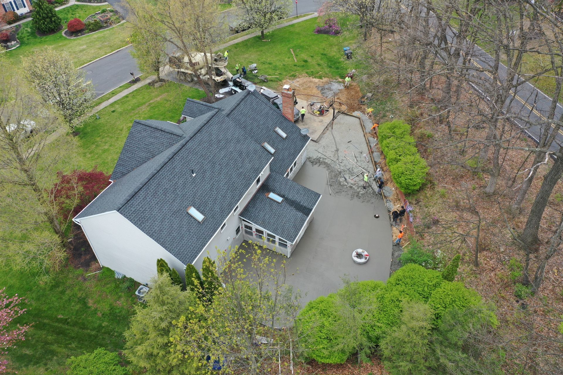 an aerial view of a house with a new roof being installed