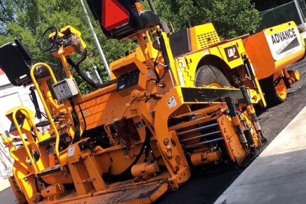 a yellow paving machine 