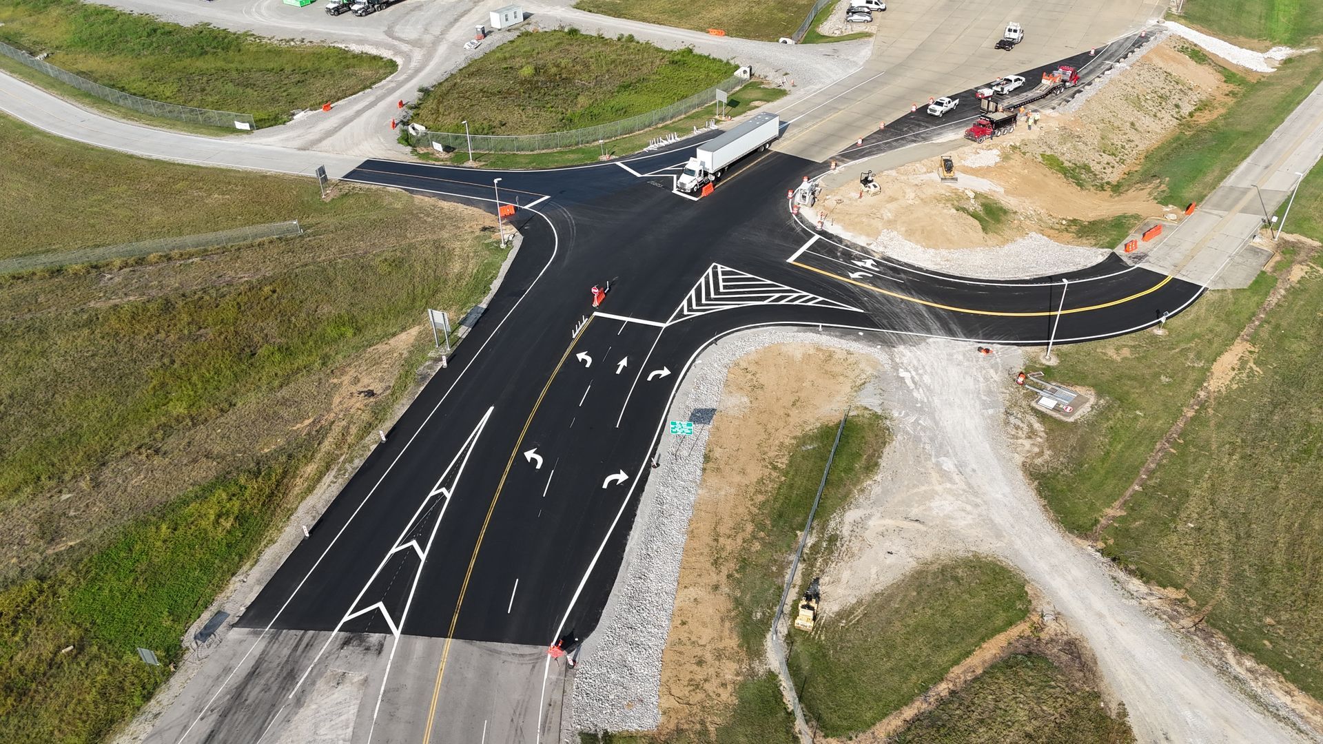 An aerial view of a newly paved road intersection