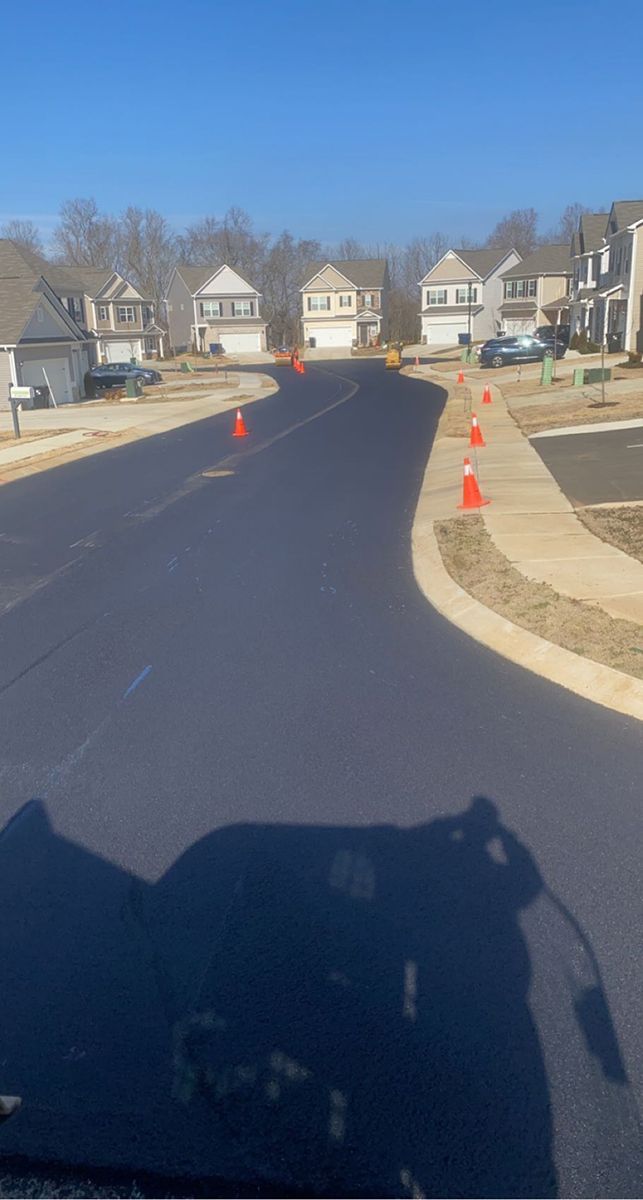 a paved road in a residential area