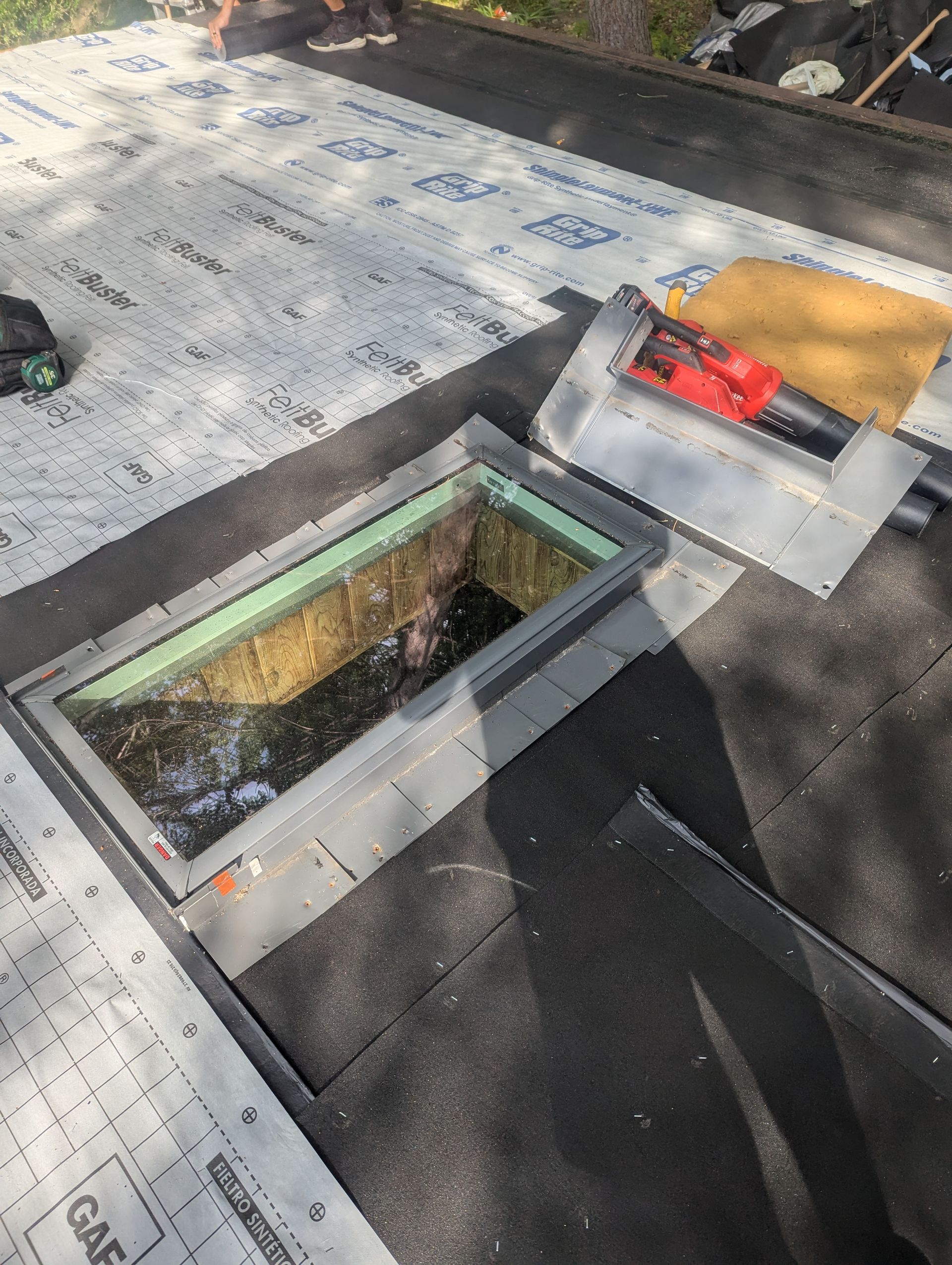 Repairing and replacing skylight on roof.