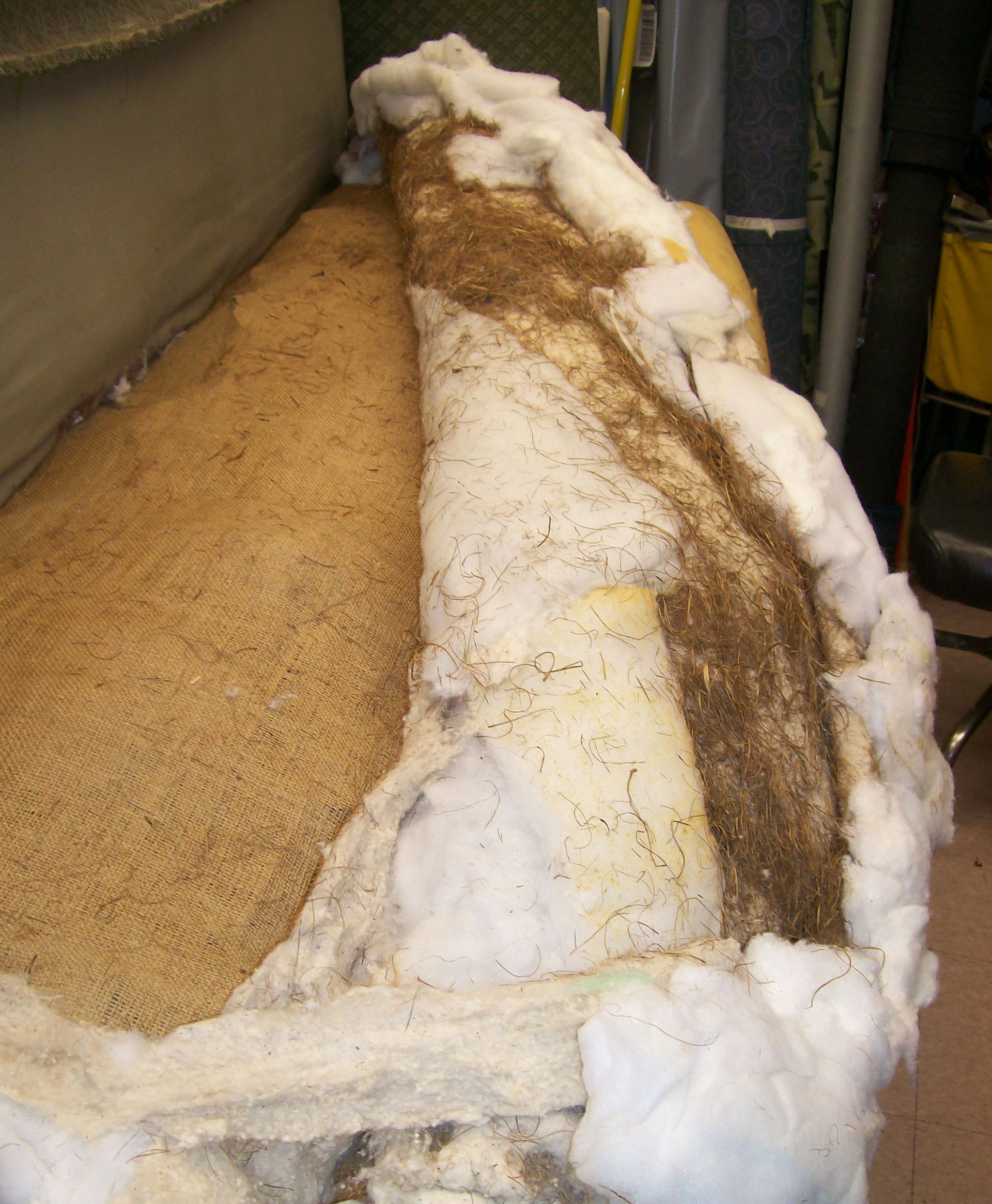 A pile of foam and sand is sitting on the floor