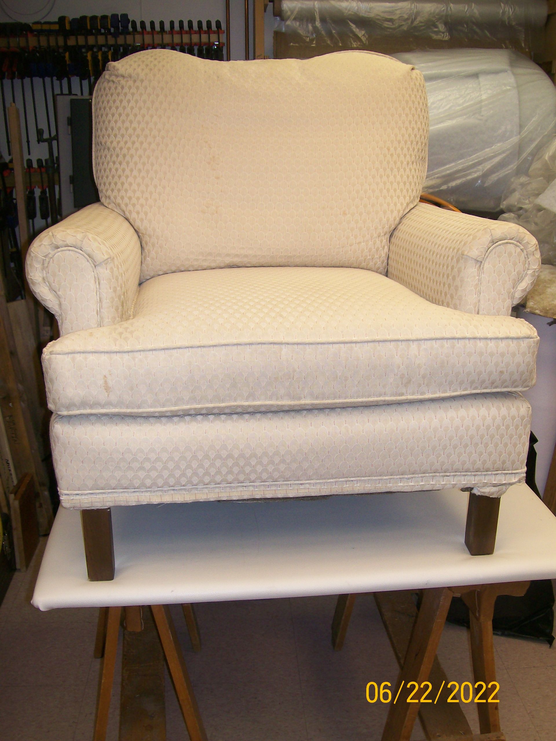 A white chair is sitting on a table