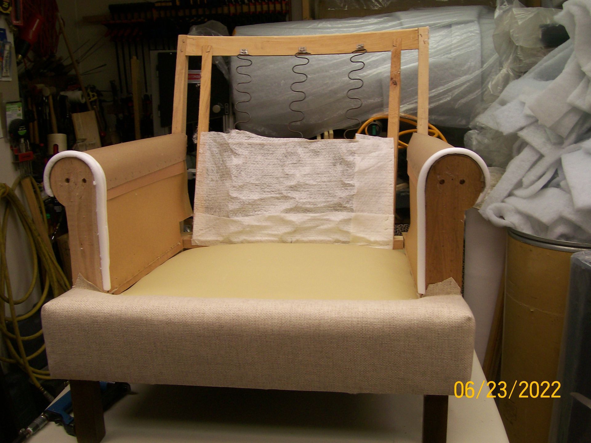 A chair is being built in a room with a lot of foam.