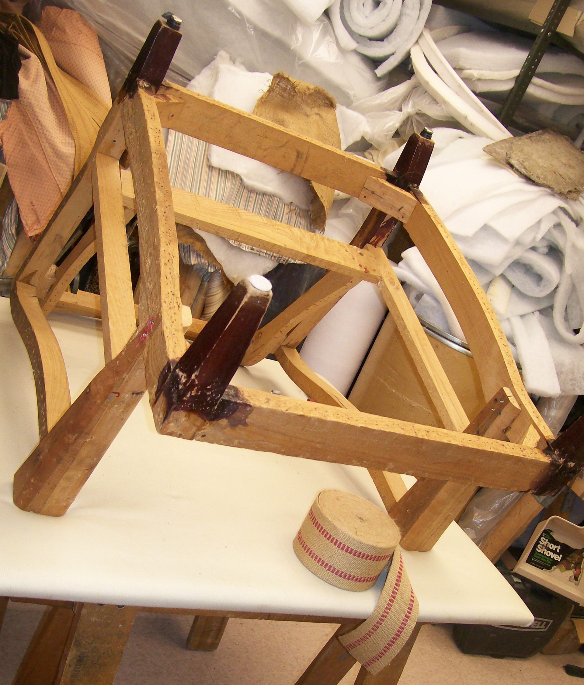 A wooden chair sitting on top of a white table