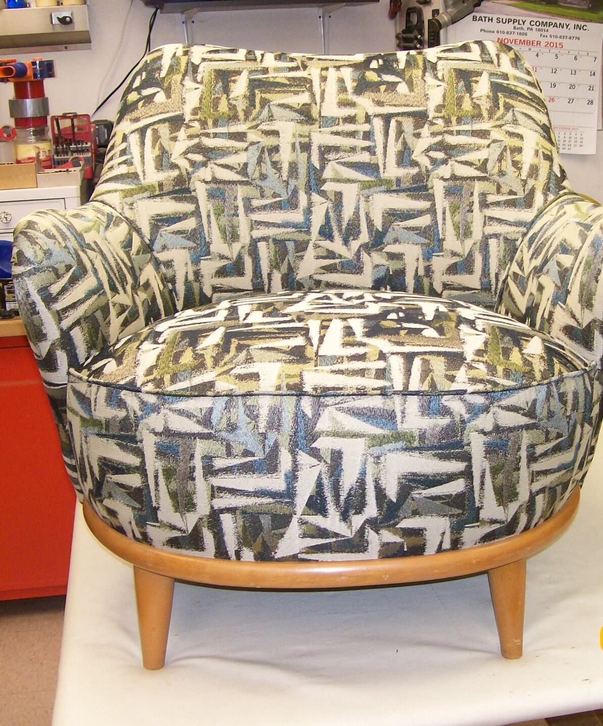 A chair with a pattern on it is sitting on a table