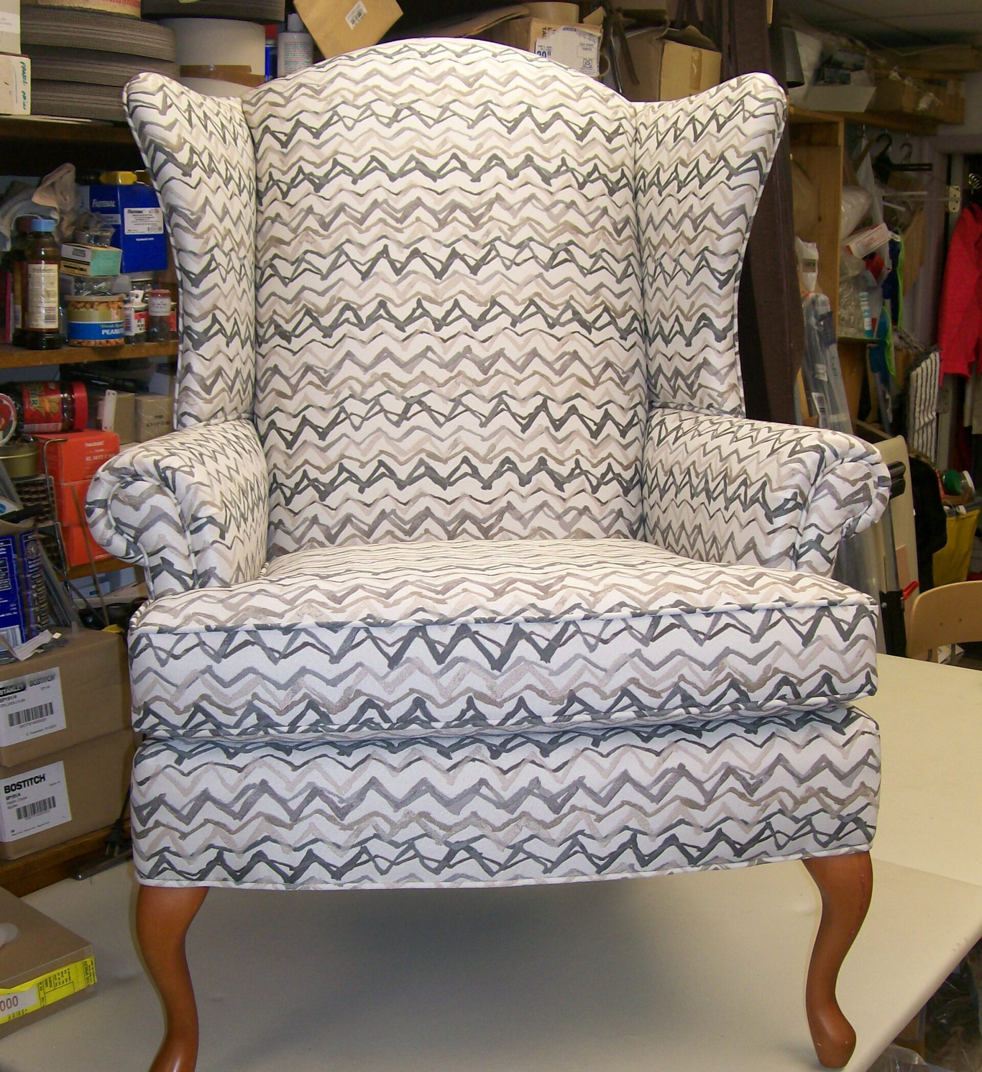 A chair with a chevron pattern is sitting on a table