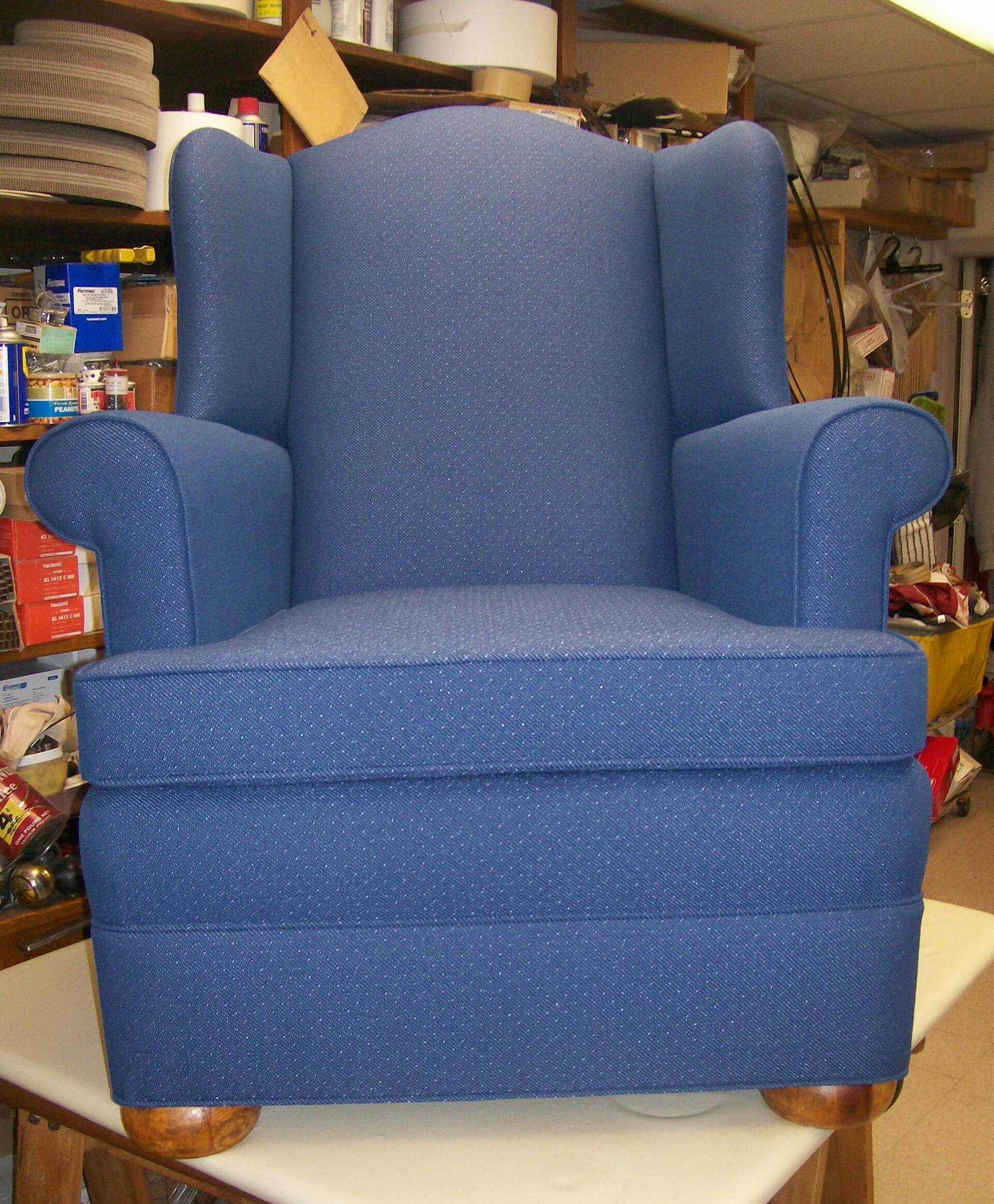 A blue chair is sitting on a table in a room