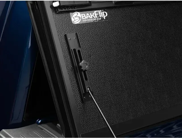 A close up of a black box with a cord attached to it.