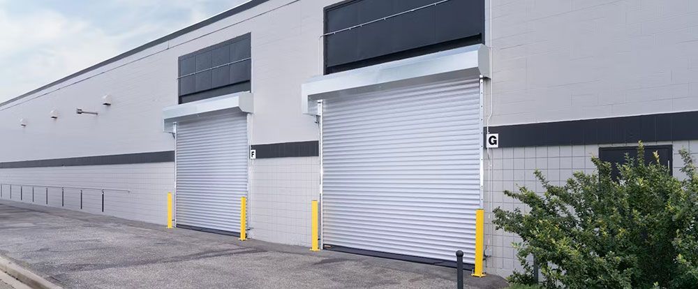 A row of garage speed doors on the side of a building