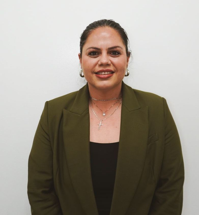 Woman with green jacket and black shirt