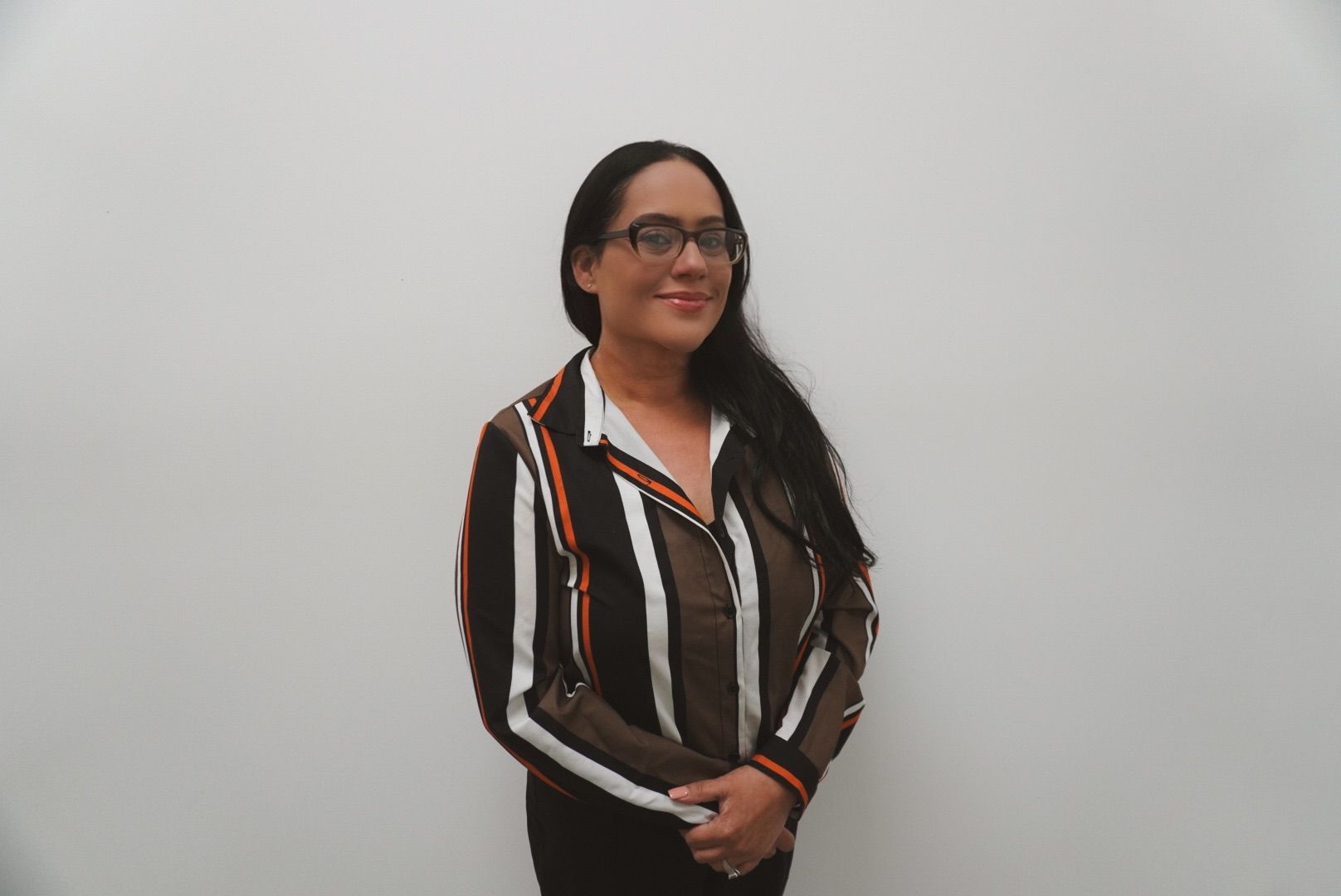 Woman standing with black and white shirt