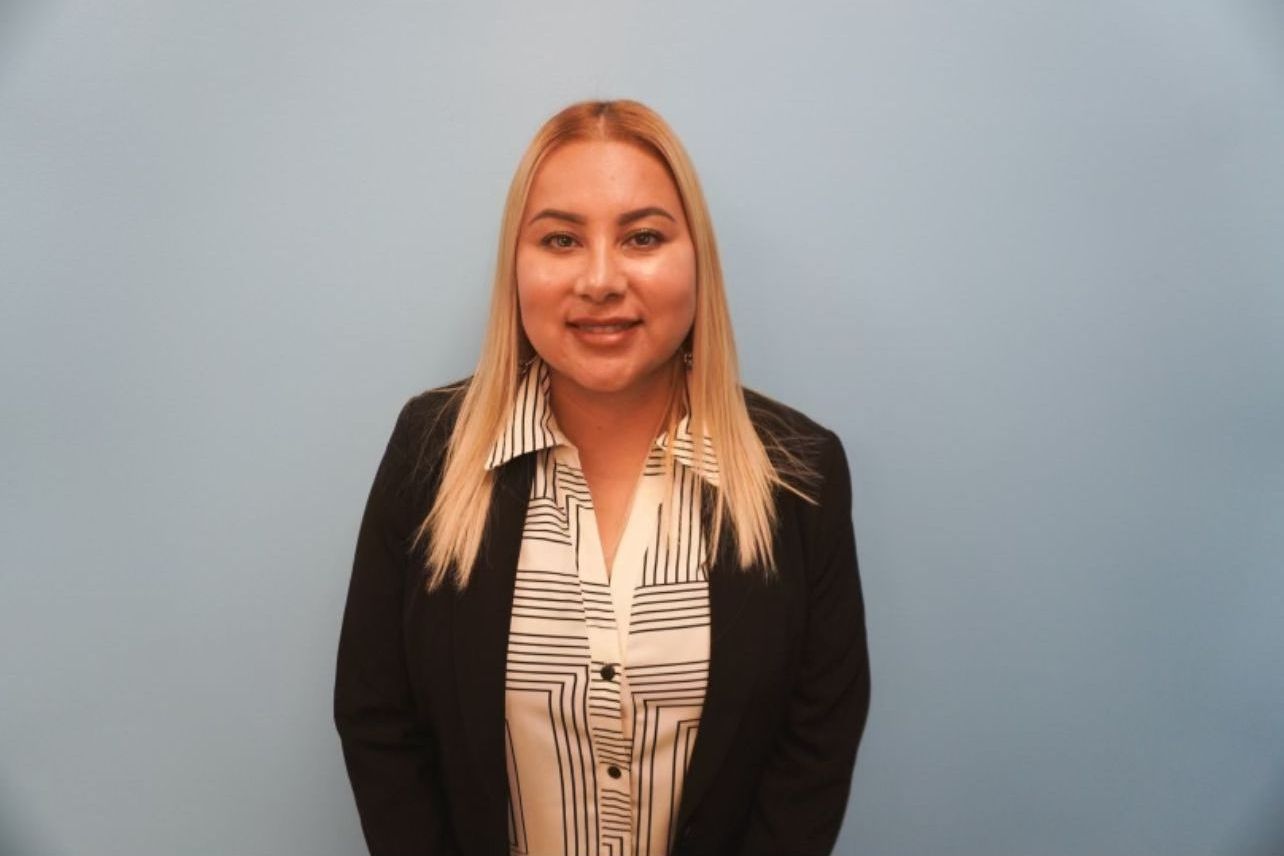 Blonde woman in black jacket