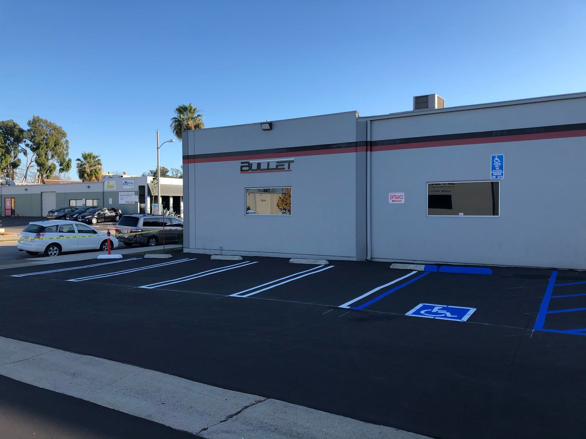 A building with a handicapped parking spot in front of it