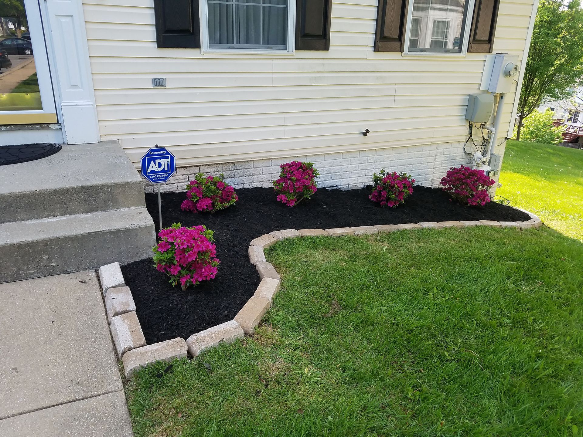 Flower décor on the side of a house