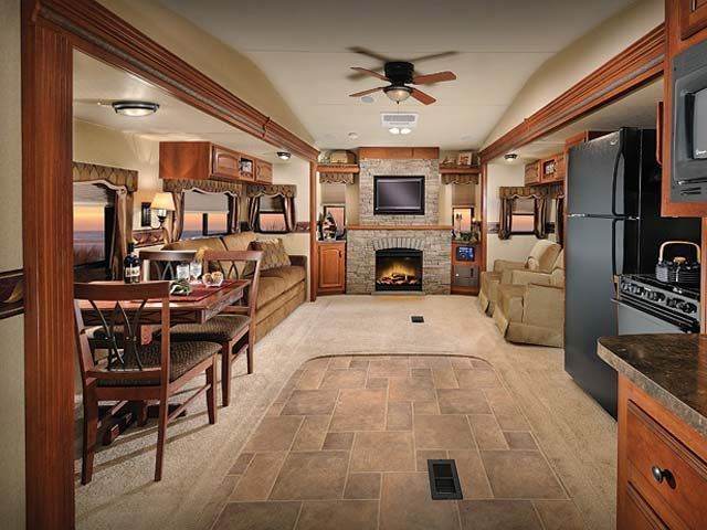 A living room with a fireplace and a television