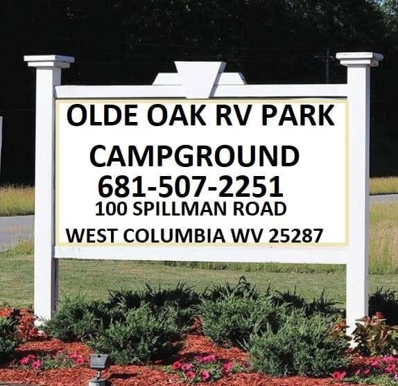 A sign for olde oak rv park campground