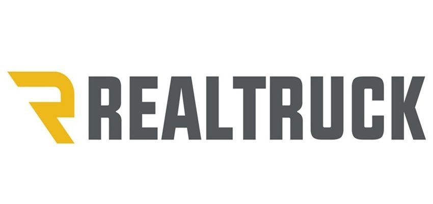 REALTRUCK logo with yellow stylized “R” and gray text on white background