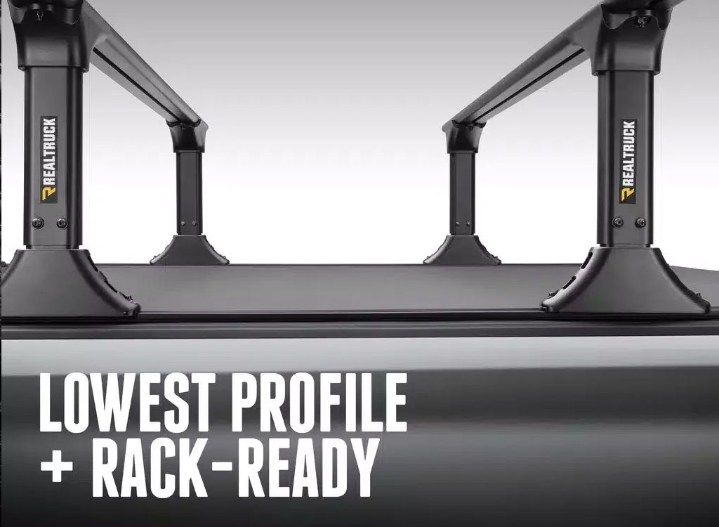 Black truck bed rack with LOWEST PROFILE + RACK-READY text on a gray background