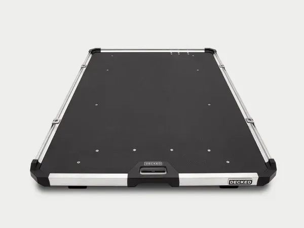 Black pool table with pockets, viewed from above on a white background