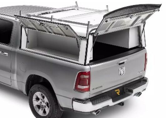 Gray pickup truck with a metal rack and open camper shell cargo cover