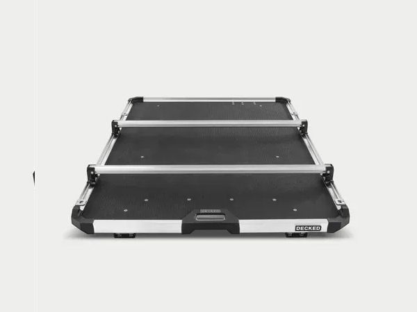 Black folding luggage cart with three shelves on a white background