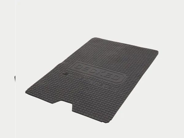 Black textured rubber floor mat with a notch, shown on a white background