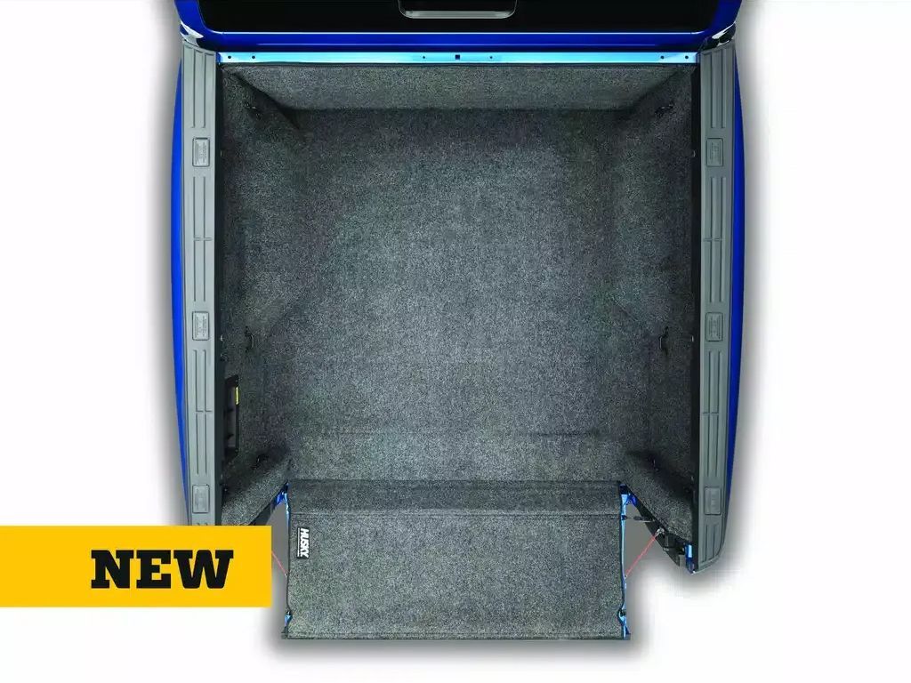 Open blue suitcase with gray interior and yellow NEW label in the corner