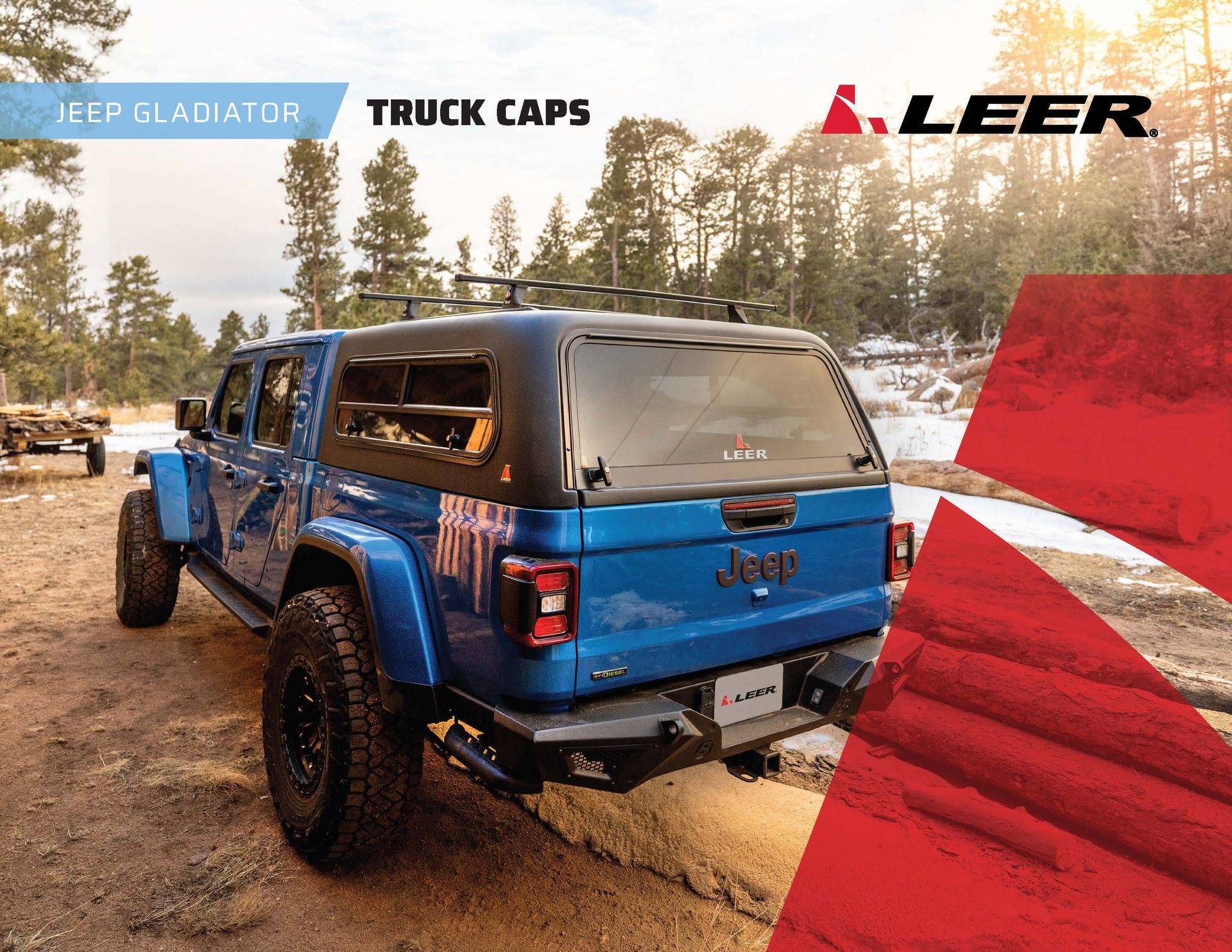 Blue Jeep truck with LEER canopy driving on a snowy forest road, truck caps ad graphic