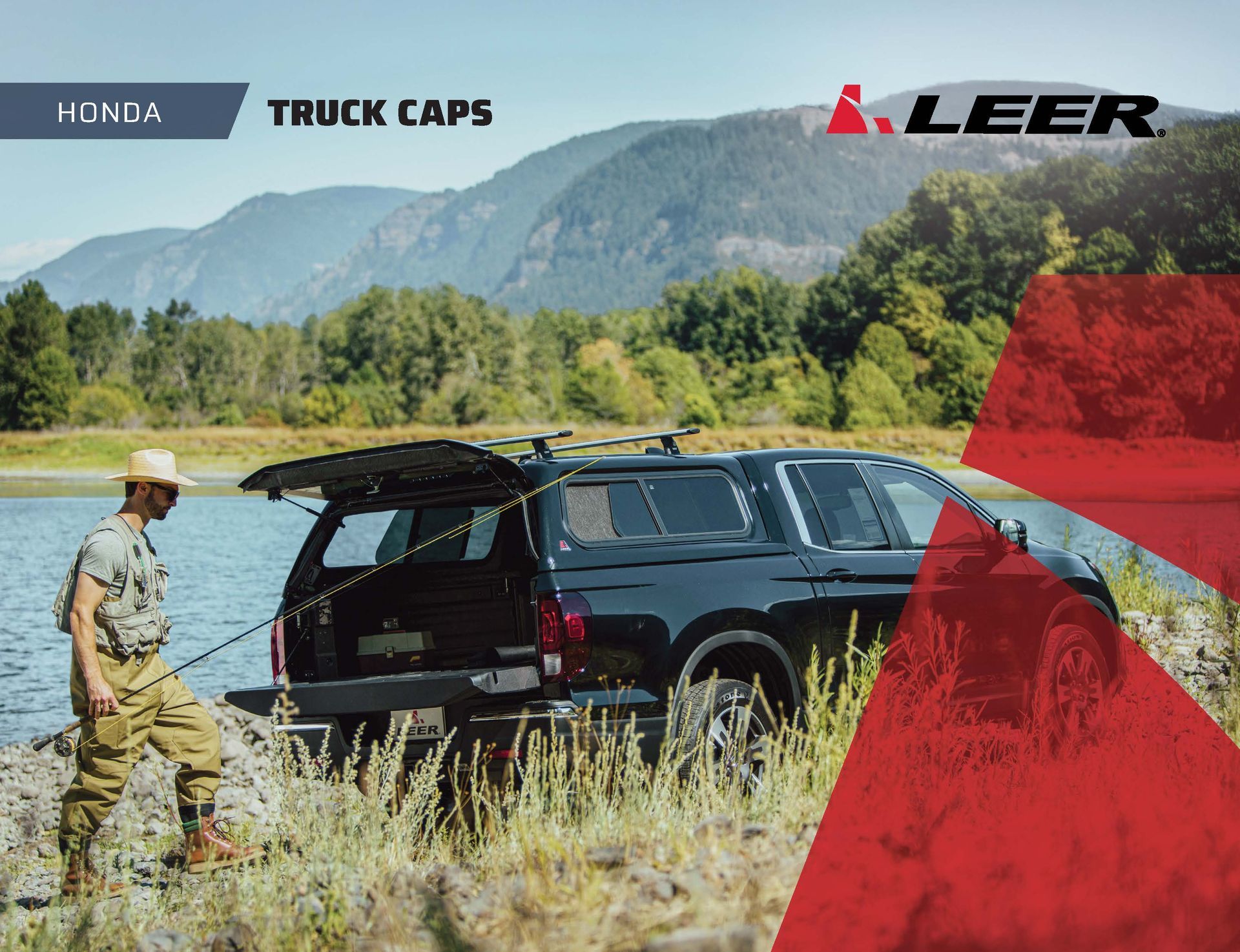 Honda truck caps ad: black pickup with open cap in a grassy mountain field, LEER logo and red graphic accents