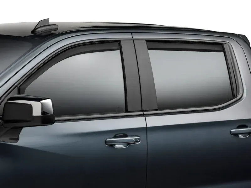 Side view of a dark gray SUV with tinted windows and silver door handles.