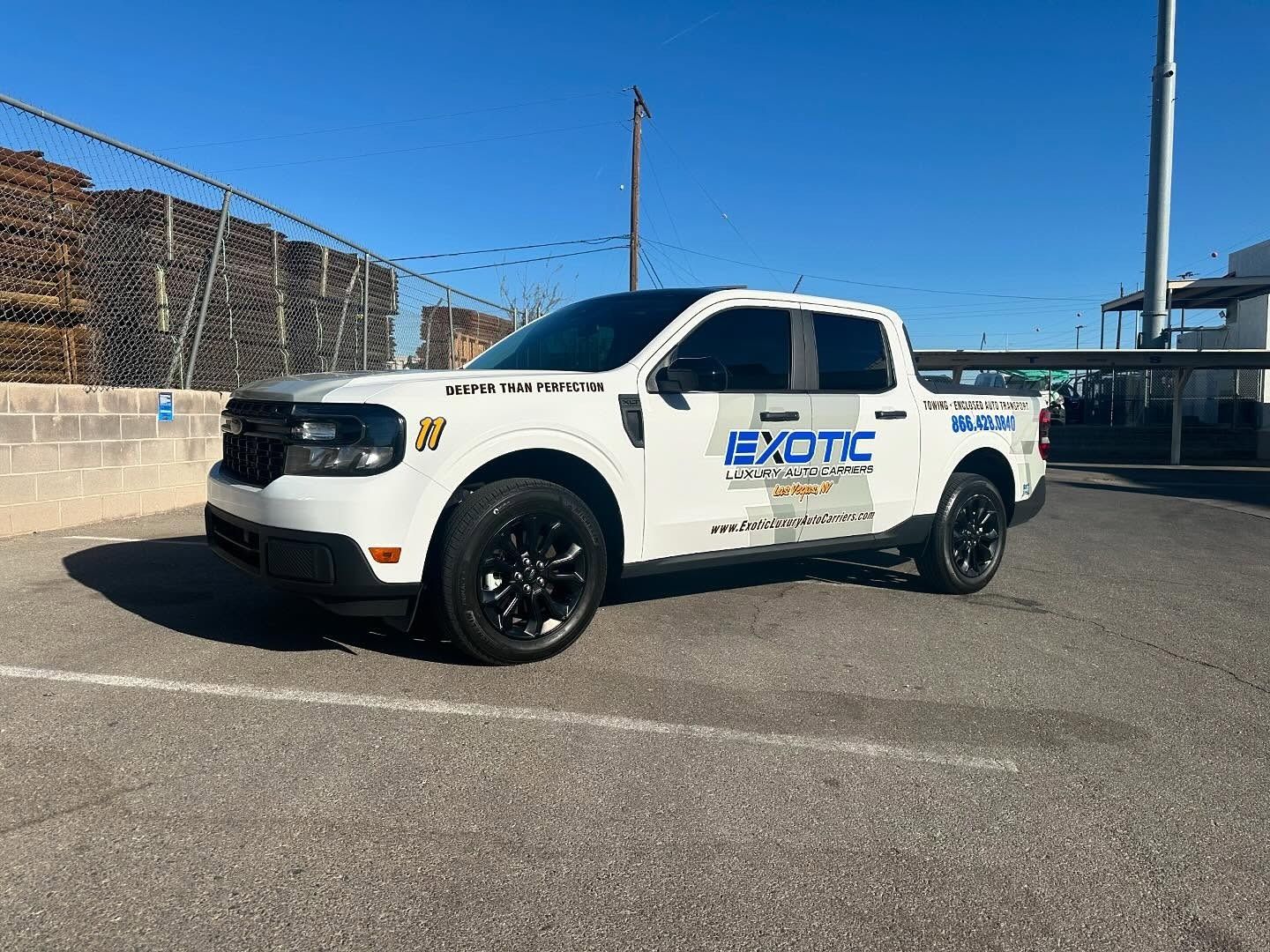 White pickup truck with black wheels, 