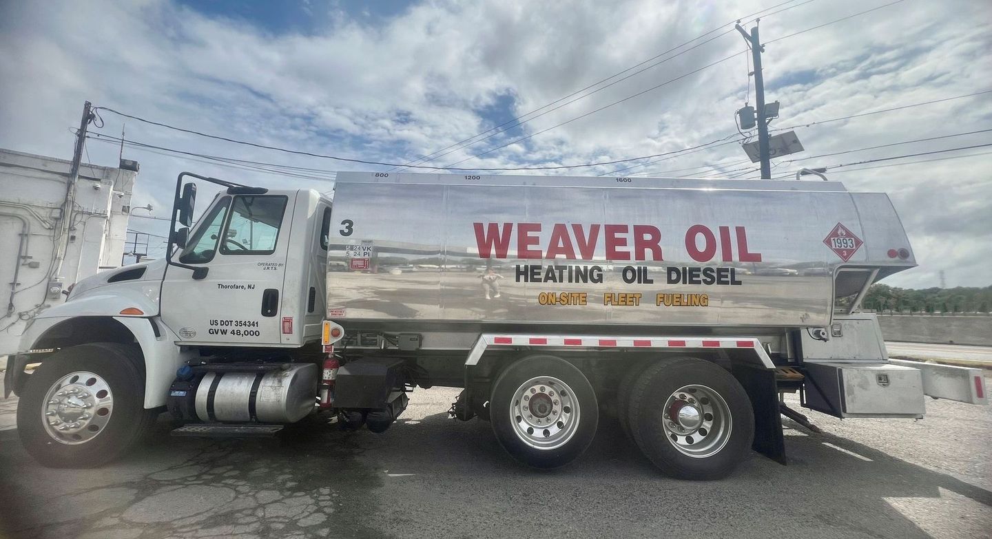 a Weaver Oil Company truck in a parking lot