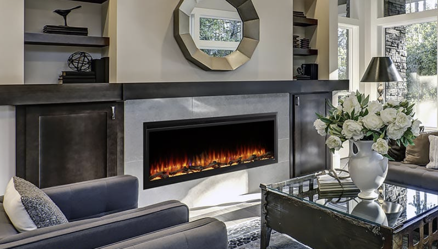 A living room with a Heatilator , couch , chairs and a coffee table.