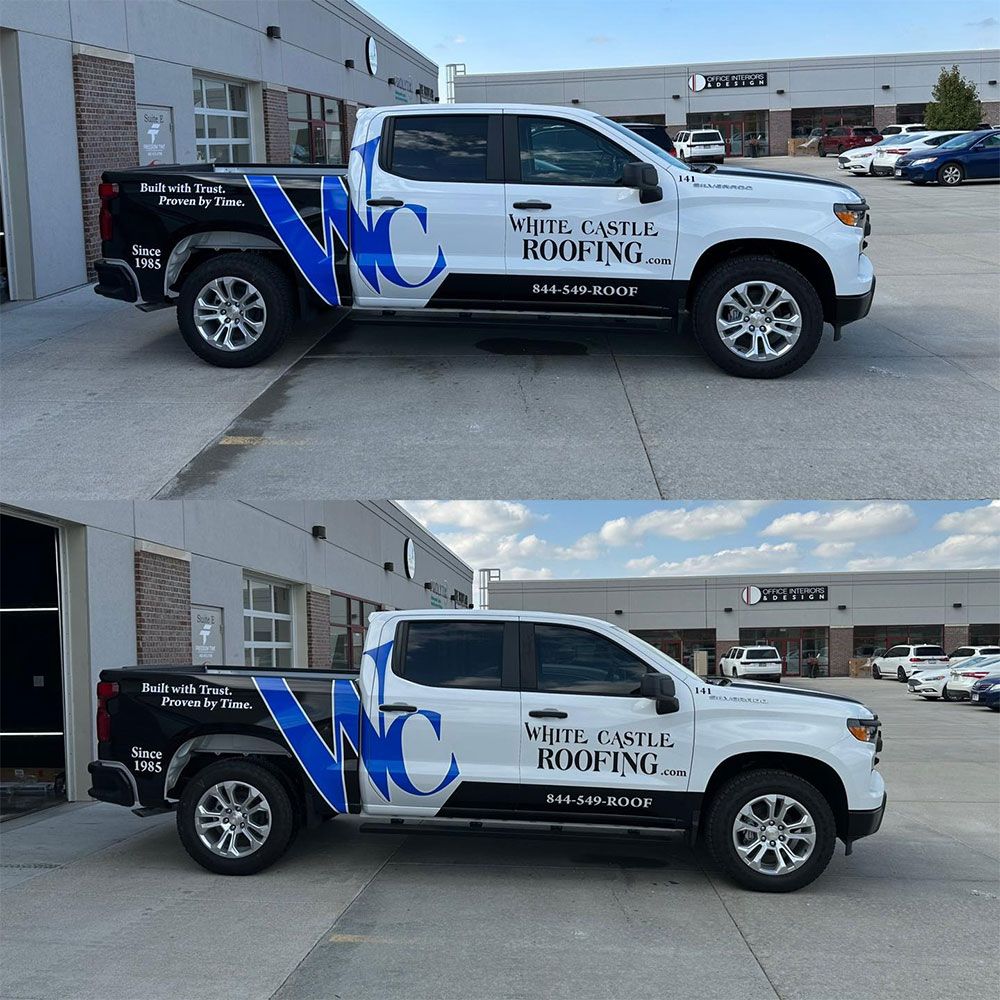 A white castle roofing truck is parked in front of a building