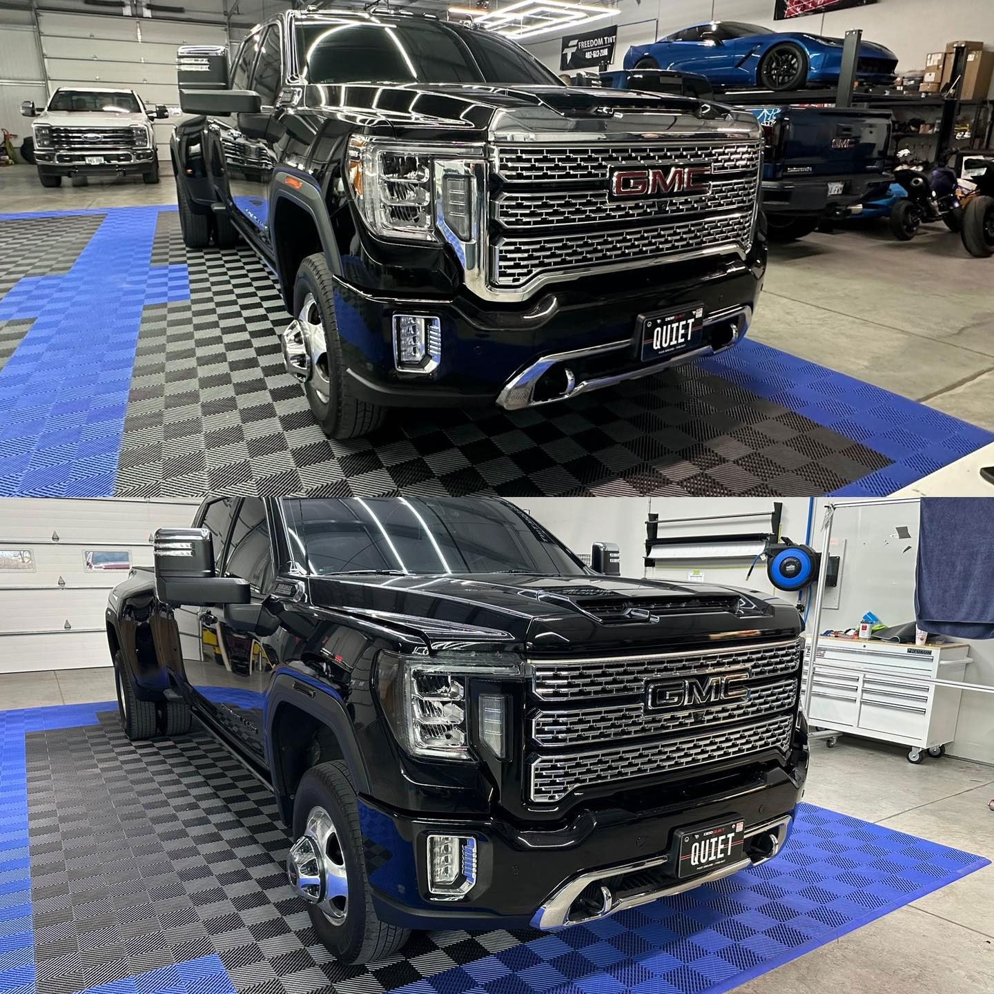 A black gmc truck is parked on a checkered floor in a garage.