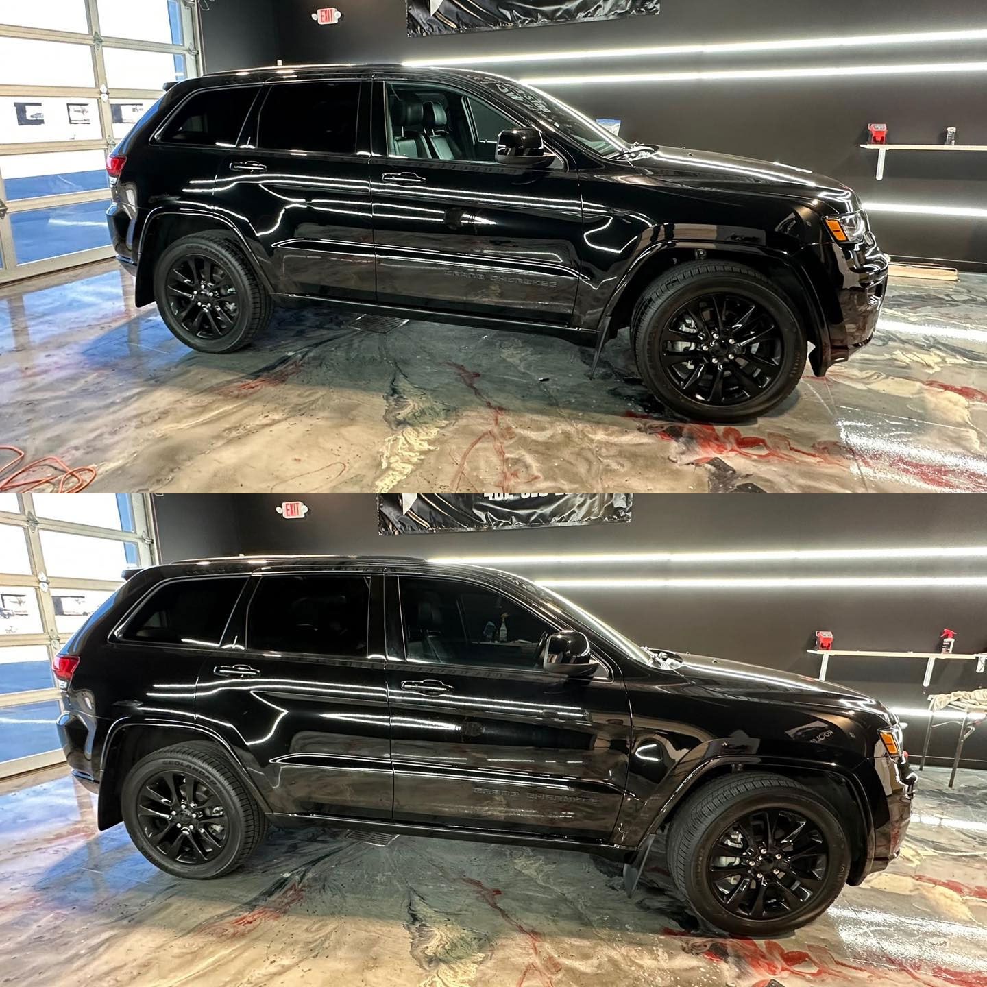 A black jeep grand cherokee is sitting in a garage.