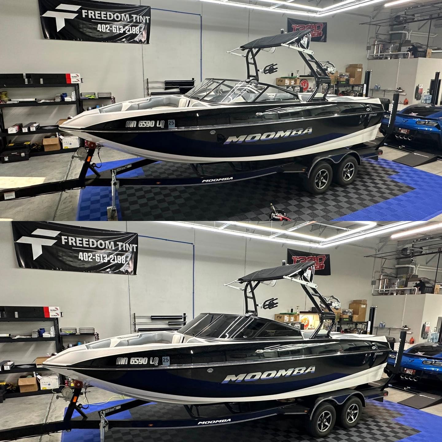 A black and white boat is parked in a garage.